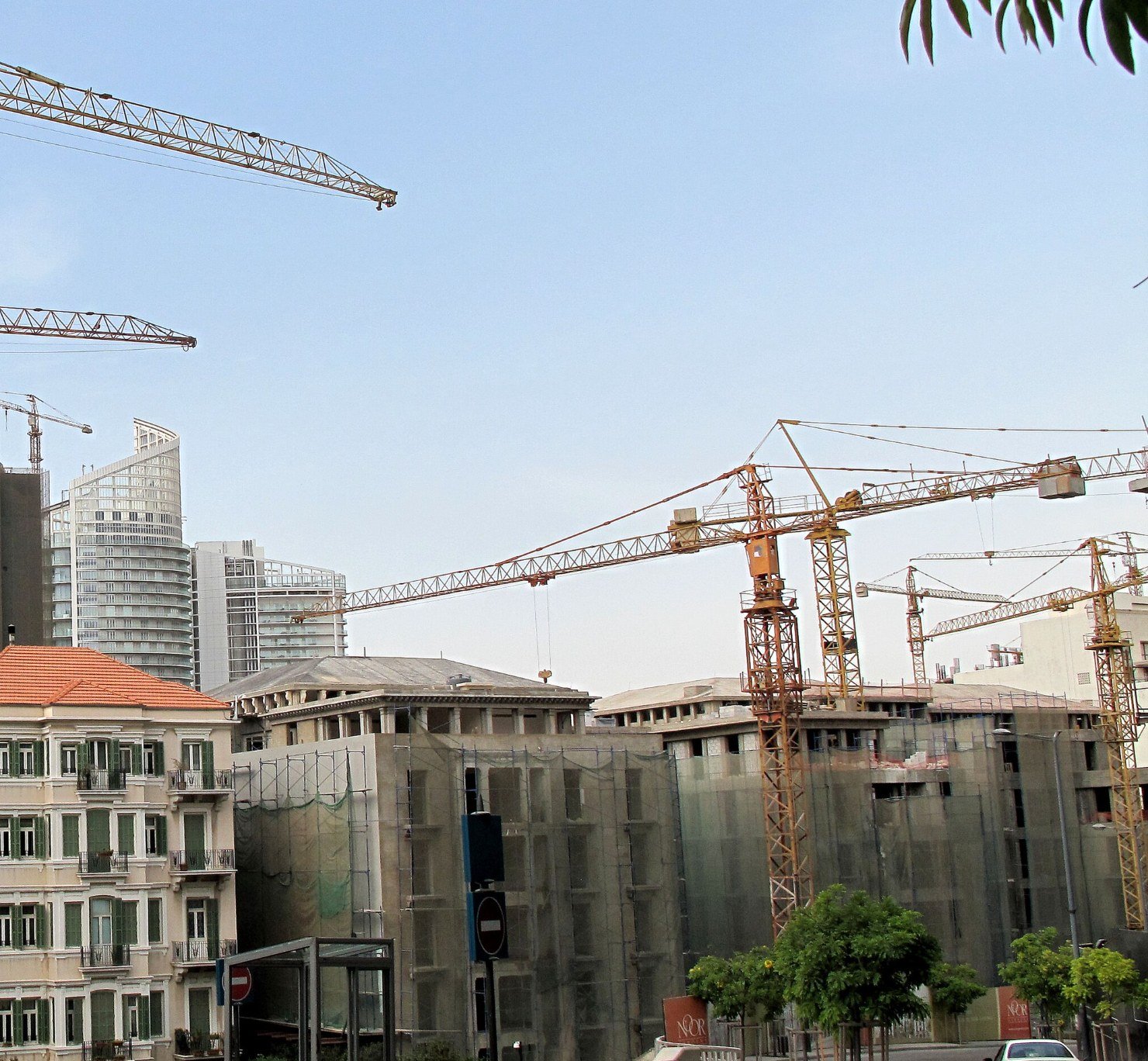 Tower cranes rising above buildings under construction in Beirut, Lebanon